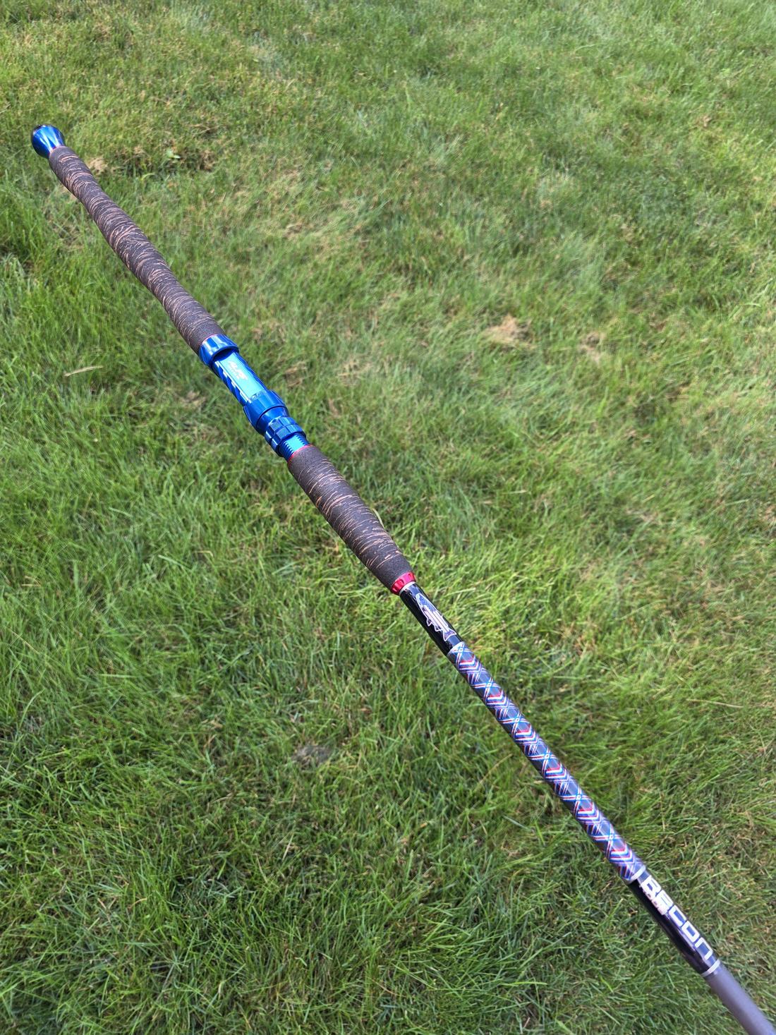 Custom rod with purple decorative wrap photographed outdoors